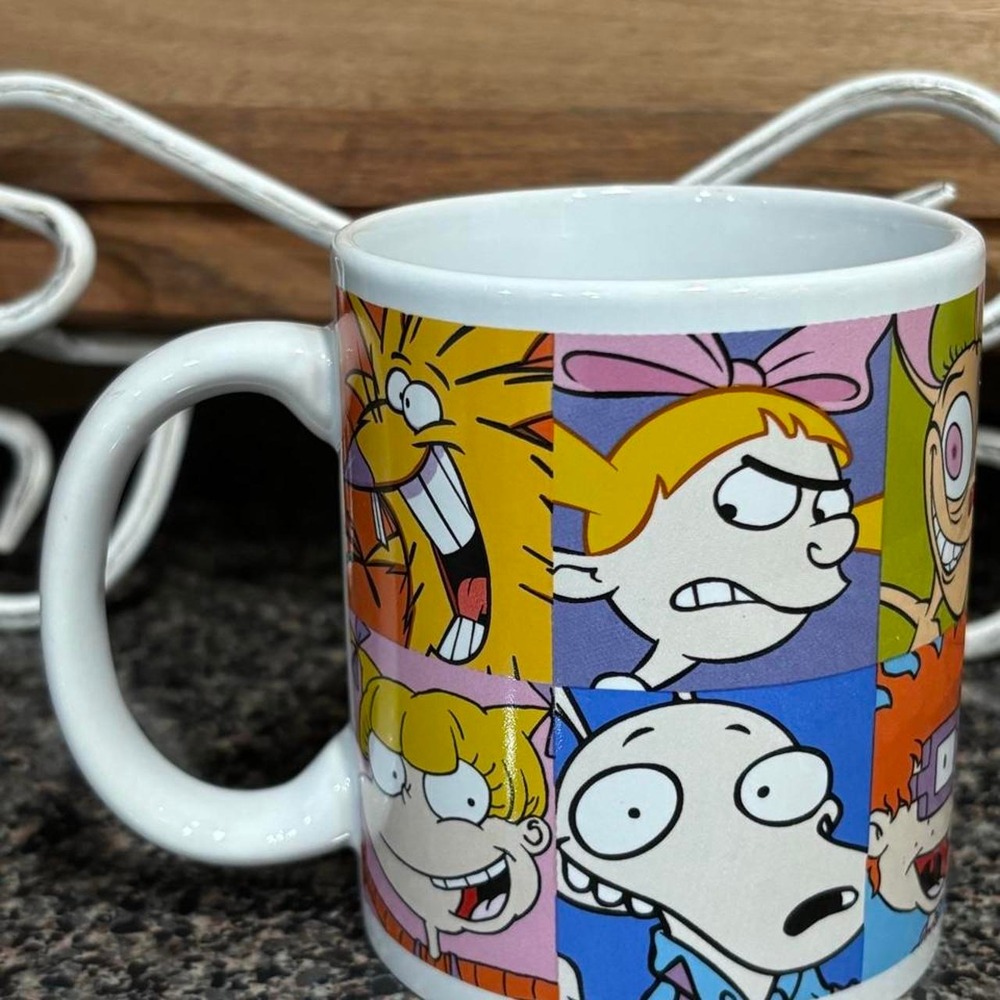 Coffee mug with Nickelodeon cartoon characters in a collage